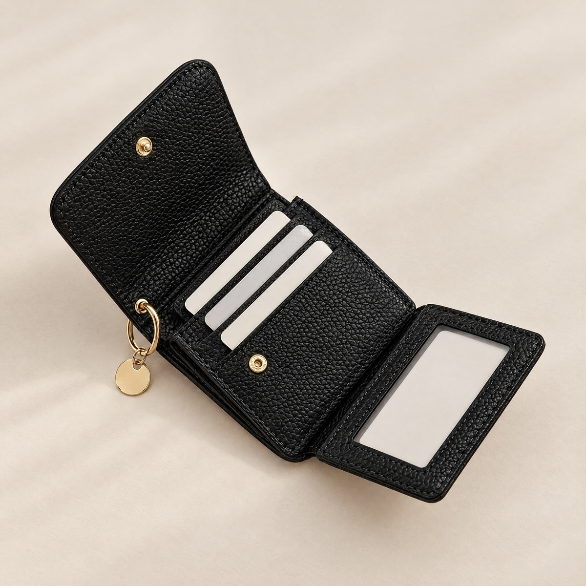 Bella RFID wallet in black opened to show card slots and clear ID window