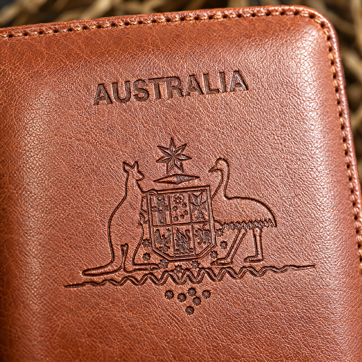 Close-up of the Australian Great Seal embossing on the brown TravelSmart RFID passport wallet